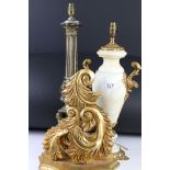 Two table lamp bases in the classical form together with a gilt wall bracket shelf.