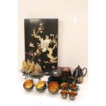 A group of oriental collectables to include tea set, wall plaque, tea caddy and ornamental junk