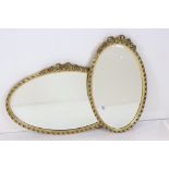 Two Gilt Framed Oval Wall Mirrors, each with ribbon and garland cresting, largest 72cm x 45cm