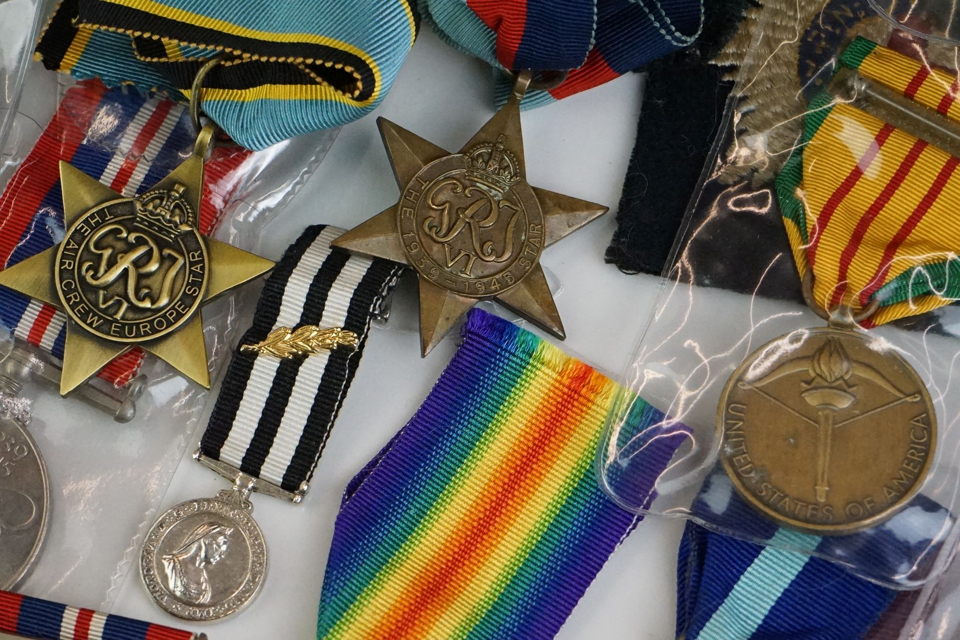 A group of military collectables to include a framed set of Royal Army Ordnance corps badges, a - Image 6 of 15