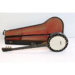 A vintage five string banjo in original fitted case.