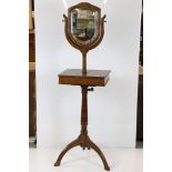 George III style Gentleman's Washstand with shield shape bevelled edge mirror and compartment with