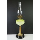 Victorian Oil Lamp with opaque moulded green glass well, brass column support and black socle