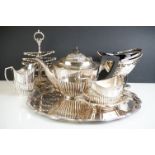 A collection of silver plated items to include serving tray, teapot, sugar bowl, cream jug...etc.