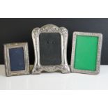 A fully hallmarked sterling silver fronted photograph frame together with two others.