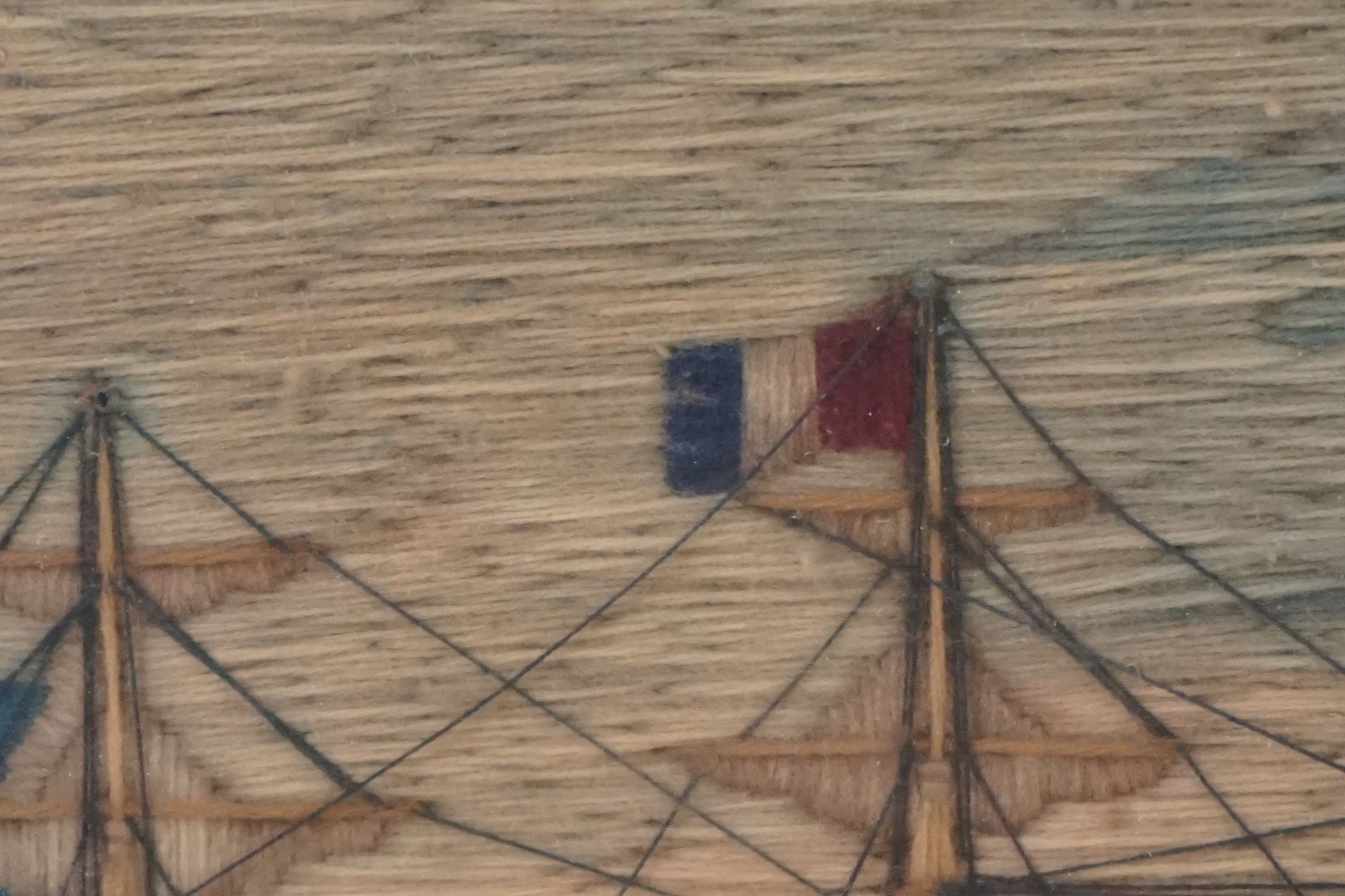 19th century Woolwork Embroidery of a Sailor stood on a rocky outcrop holding a flag with French and - Image 10 of 12