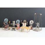 A collection of five early 20th century cold painted spelter novelty cat figures together with a