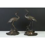 Pair of 19th century bronze groups of a crane standing on a lily pad with a turtle, repaired,
