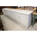 Large 19th / Early 20th century Painted Pine Dresser Base with four sets of double panel doors,