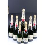 Seven Shop Display Empty Bottles of Moet & Chandon Champagne, all with corks and seals, sizes