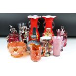 A collection of glassware, to include: a pair of Victorian Cranberry glass jars and covers, a pair