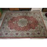 Red Ground Rug with Perisan style design, approximately 236cm x 168cm