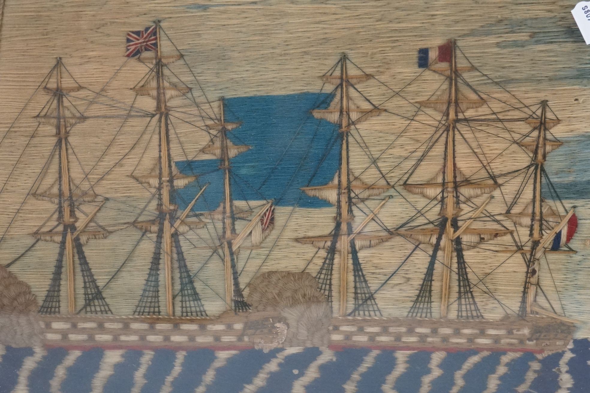 19th century Woolwork Embroidery of a Sailor stood on a rocky outcrop holding a flag with French and - Image 7 of 12
