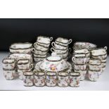 A Coalport part tea and coffee service of quatrefoil design, printed and painted with floral sprays,