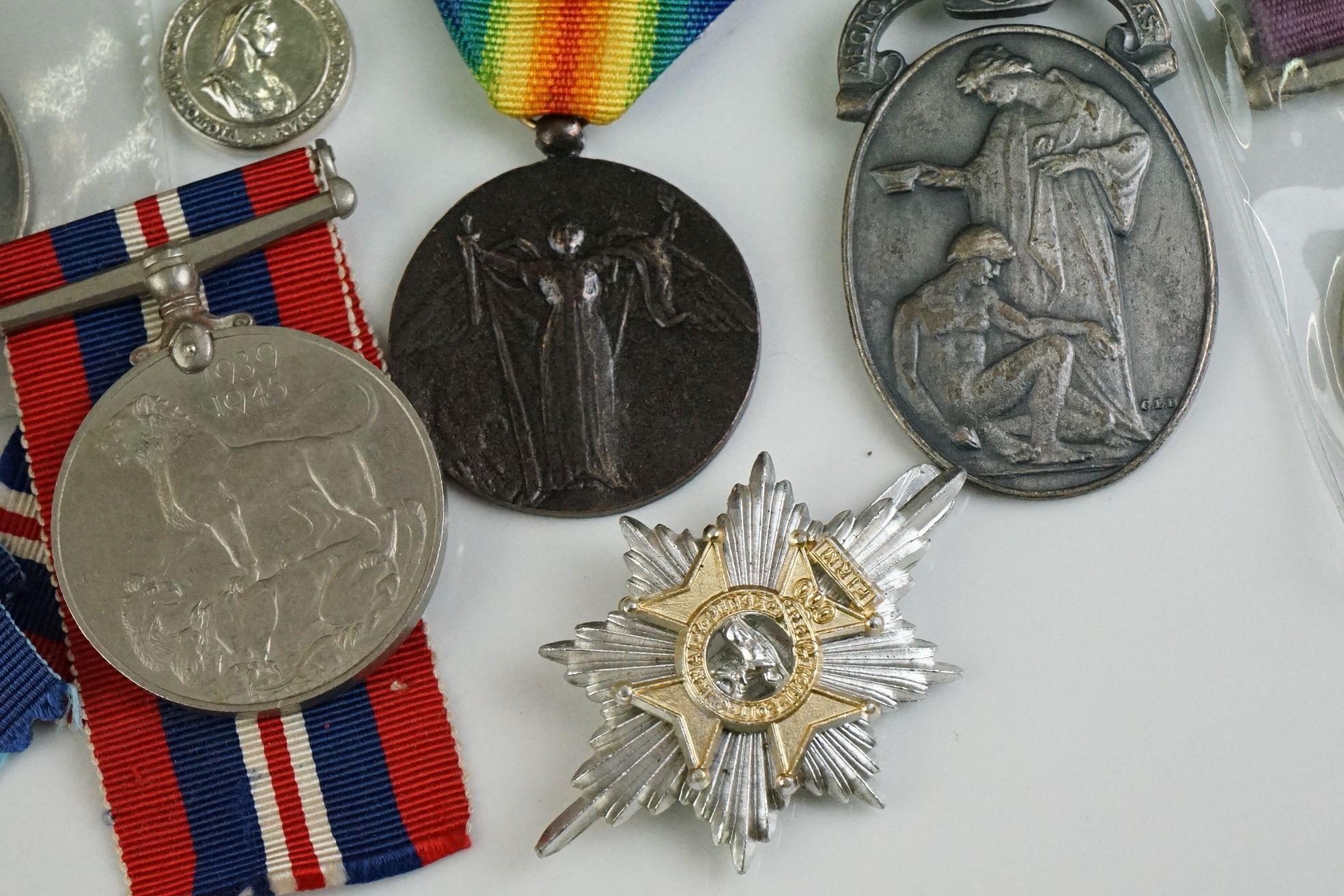 A group of military collectables to include a framed set of Royal Army Ordnance corps badges, a - Image 5 of 15