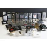 A large collection of approx sixty Zippo lighters to include military and advertising examples,