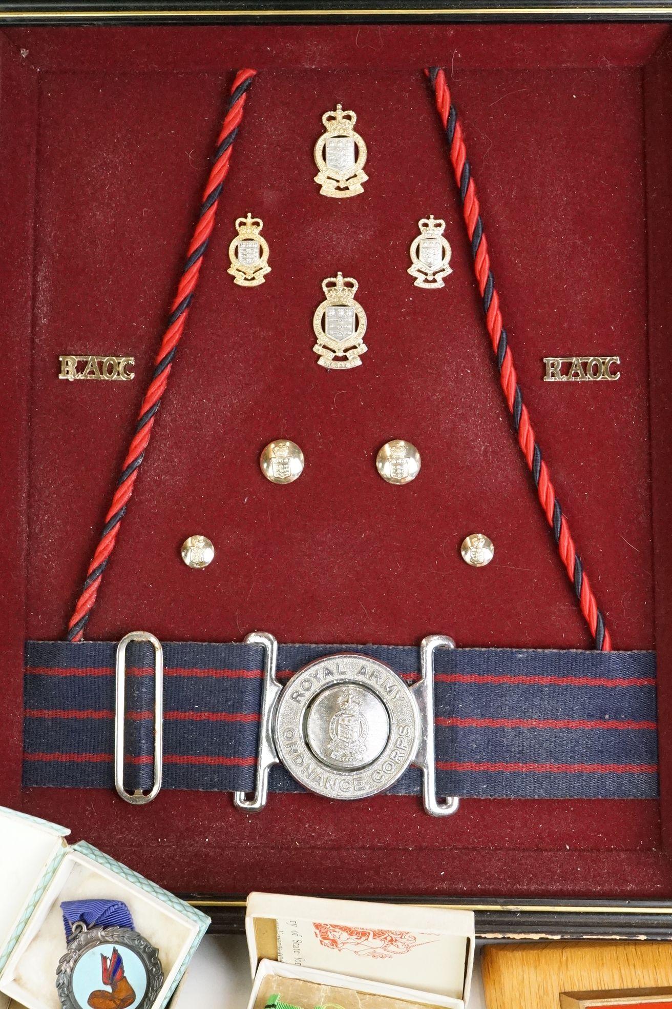 A group of military collectables to include a framed set of Royal Army Ordnance corps badges, a - Image 15 of 15