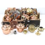 A large collection of mixed brass and copper ware to include teapots, trivets, jugs, pots and