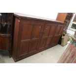 Late 19th / Early 20th century Large Stained Pine Cupboard, the three panel doors opening to shelves