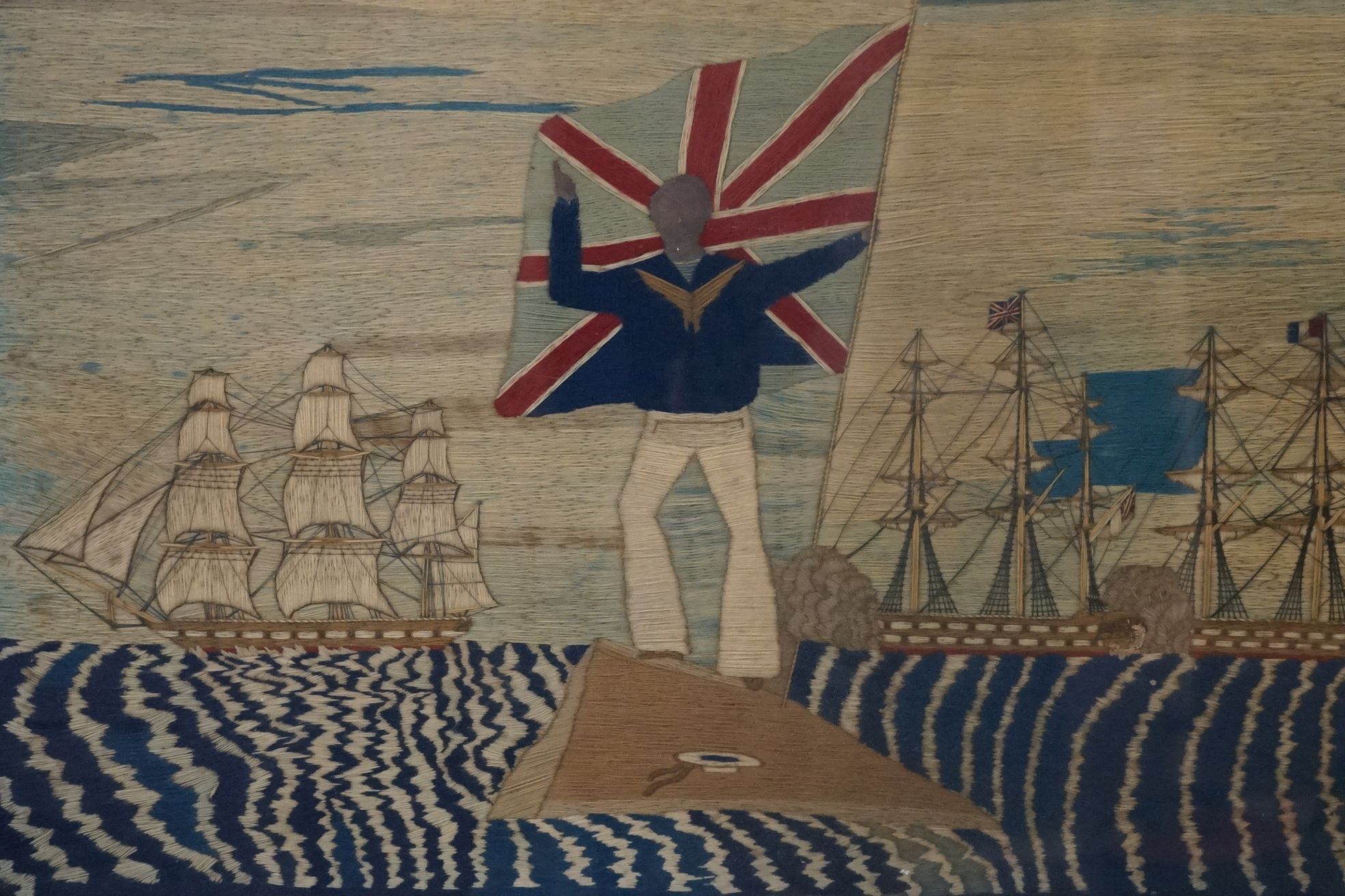 19th century Woolwork Embroidery of a Sailor stood on a rocky outcrop holding a flag with French and - Image 2 of 12