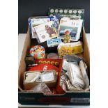 A box of mixed collectables to include coins, tea cards, advertising tins, whistle, tokens...etc.