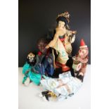 A small group of collectables to include souvenir doll, hand puppets and wind up monkey.