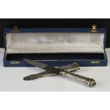 An Argentinian silver handled Gaucho knife complete with matching silver scabbard.