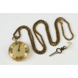 A yellow metal cased fob watch with golden coloured dial and chain.