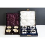 Cased set of four silver gilt salt cellars & spoons, Birmingham 1897 and a cased set of four