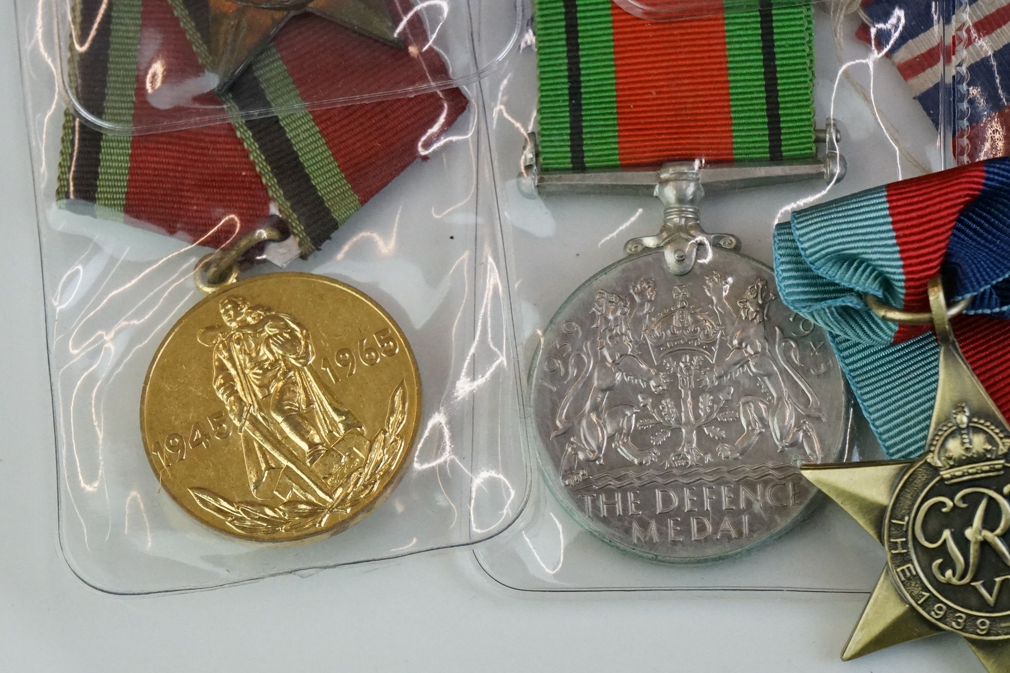A group of military collectables to include a framed set of Royal Army Ordnance corps badges, a - Image 8 of 15