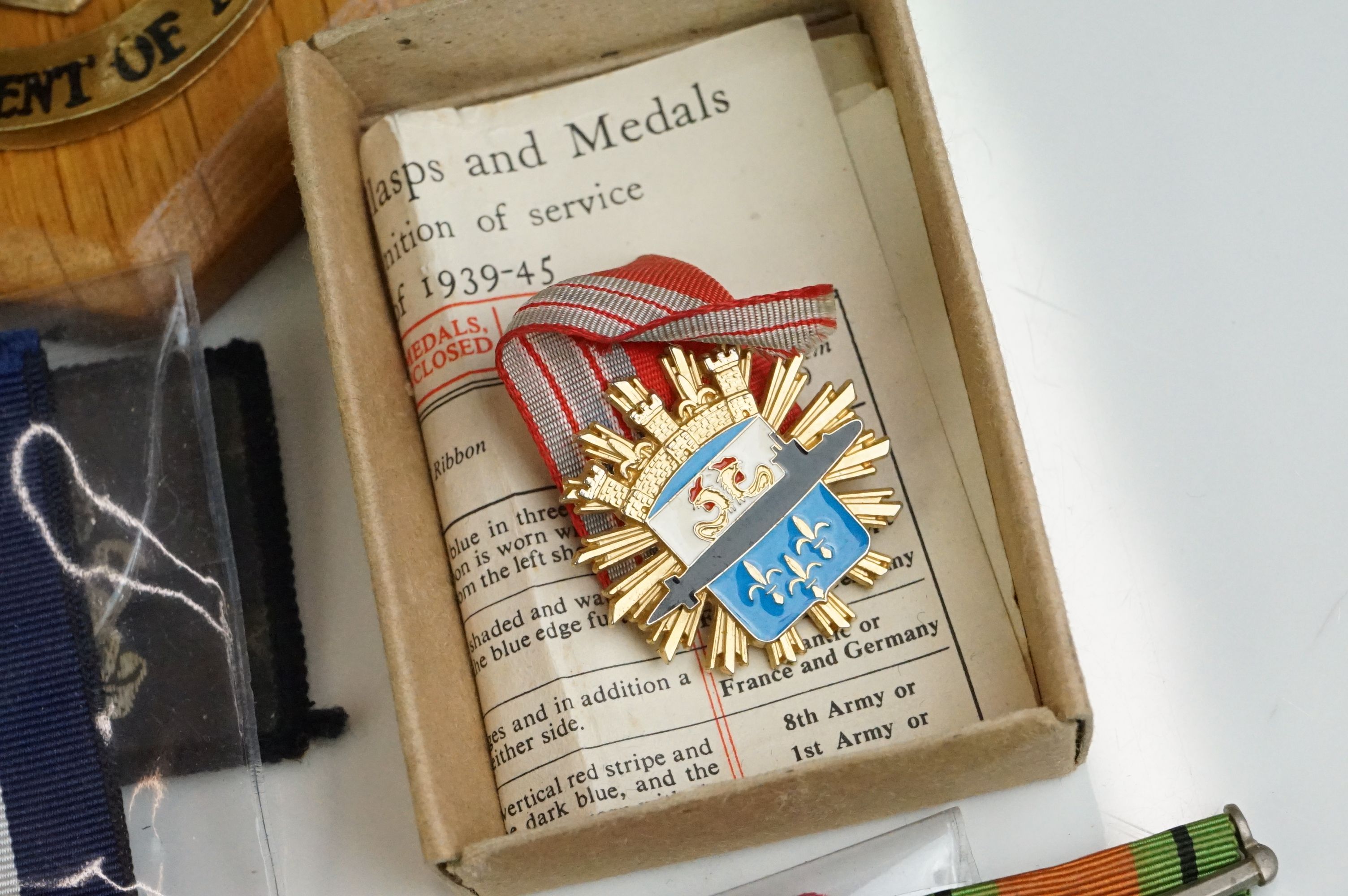 A group of military collectables to include a framed set of Royal Army Ordnance corps badges, a - Image 2 of 15