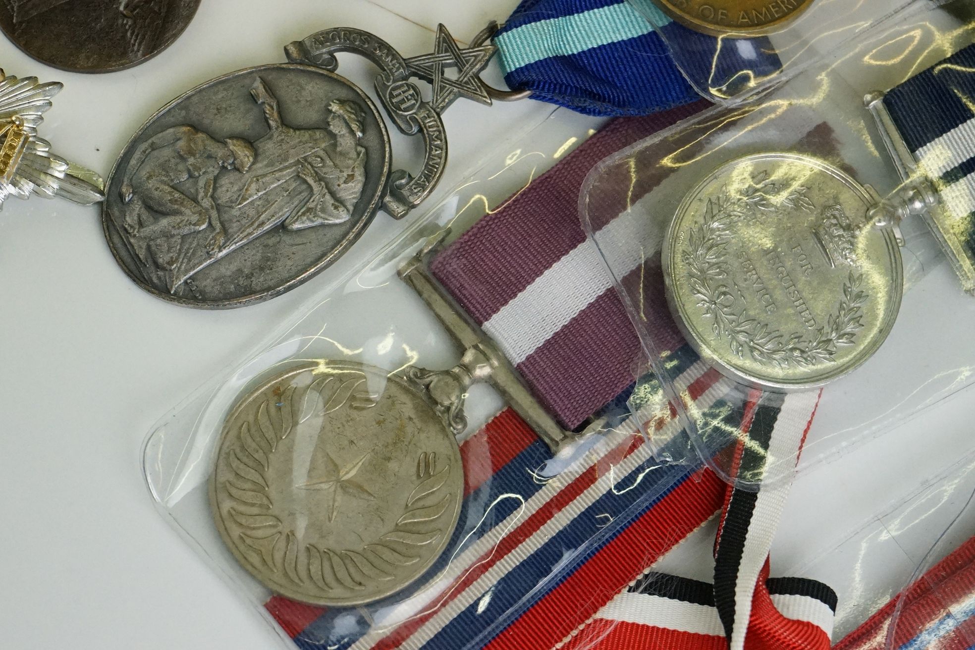 A group of military collectables to include a framed set of Royal Army Ordnance corps badges, a - Image 4 of 15