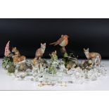A collection of Swarovski figures, to include a squirrel, a penguin and other similar glass items,