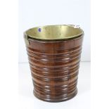 George III style Mahogany Bucket of ribbed staved construction with brass liner and swing handle,