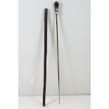 A vintage Bamboo sword stick with white metal collar.