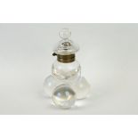 An early 20th century glass bubble inkwell with brass fittings.