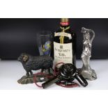 A small group of mixed collectables to include a cast iron door stop in the form of a ram and a