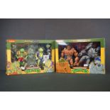 Two boxed Neca Teenage Mutant Ninja Turtles TMNT figure sets to include Rasputin and Genghis and