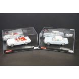 Two Cased Carrera Evolution James Bond 007 slot cars to include 25737 Goldfinger Ford Mustang