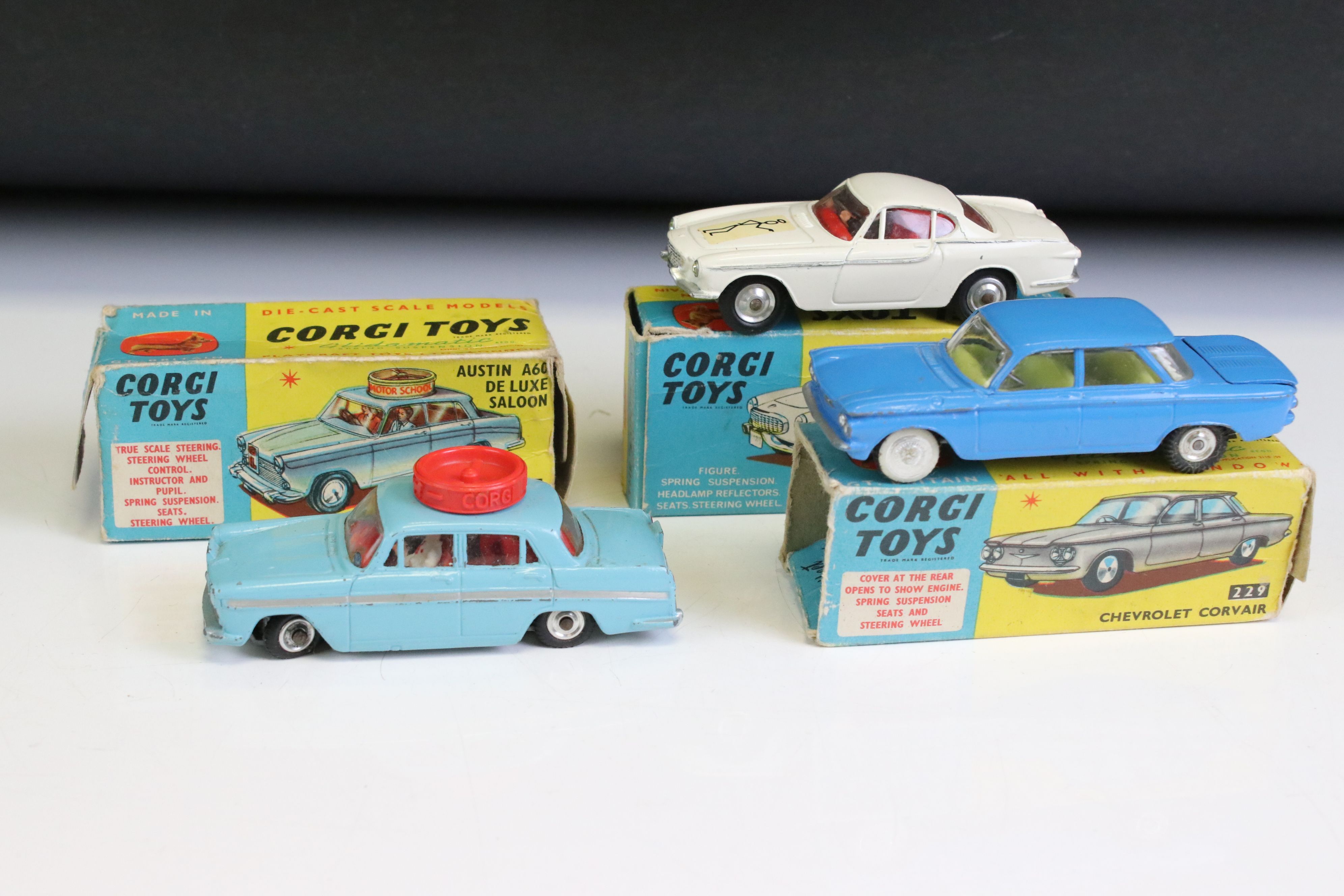 Three boxed Corgi diecast models to include 229 Chevrolet Corvair in pale blue with yellow