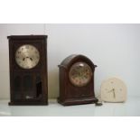 A collection of three vintage clocks to include a Wooden cased wall clock and two mantle clocks.
