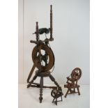 Turned Wooden Spinning Wheel, 93cm high together with Two Wooden Models of Spinning Wheels,