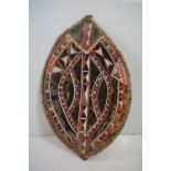 East African Maasai tribal hide shield, with geometric painted decoration in red, black and white,