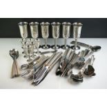 A set of silver plated goblets together with a quantity of flatware.