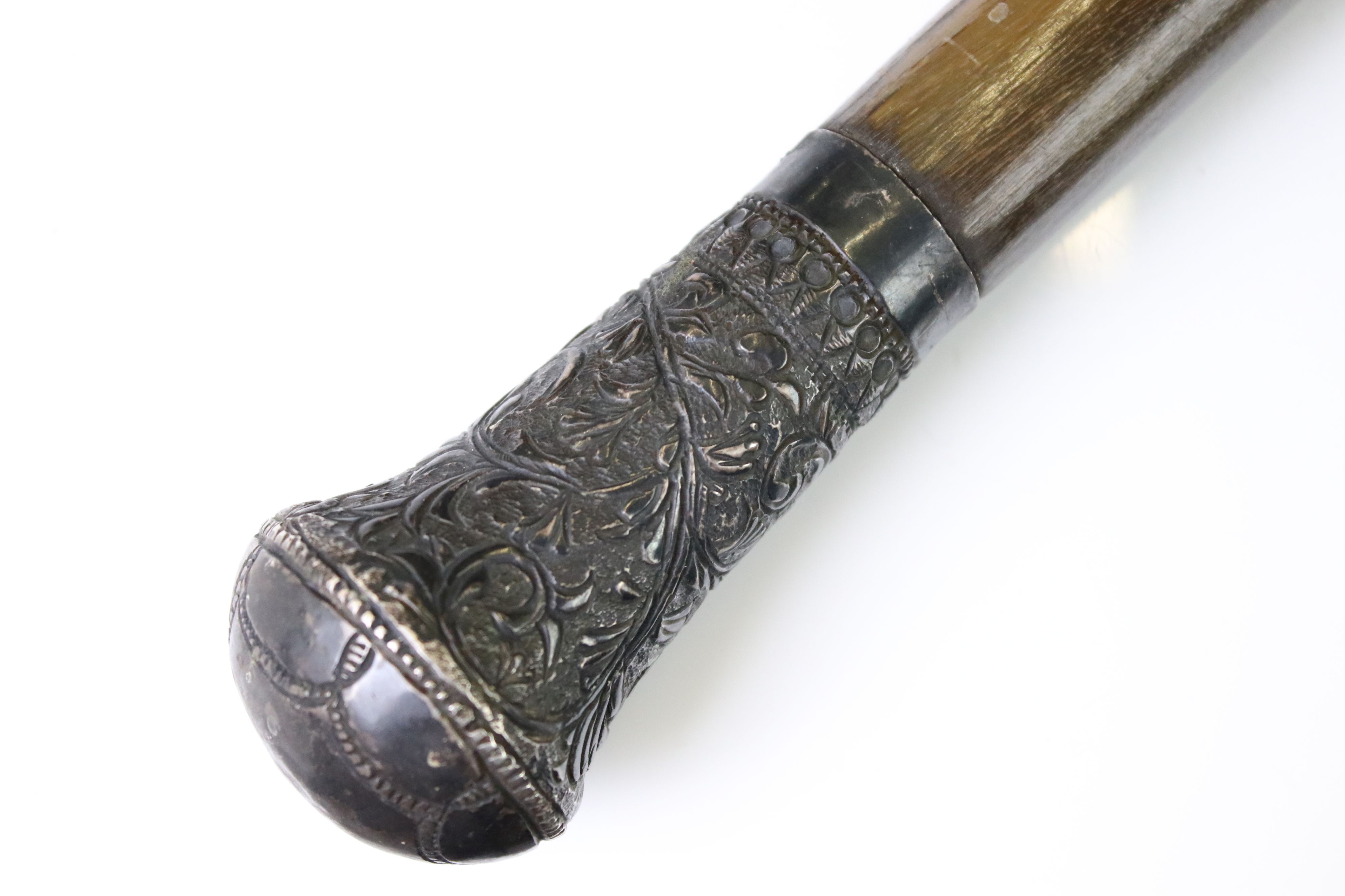 19th century rhino horn walking stick with white metal pommel, collar & ferrule, the pommel repousse - Image 2 of 6