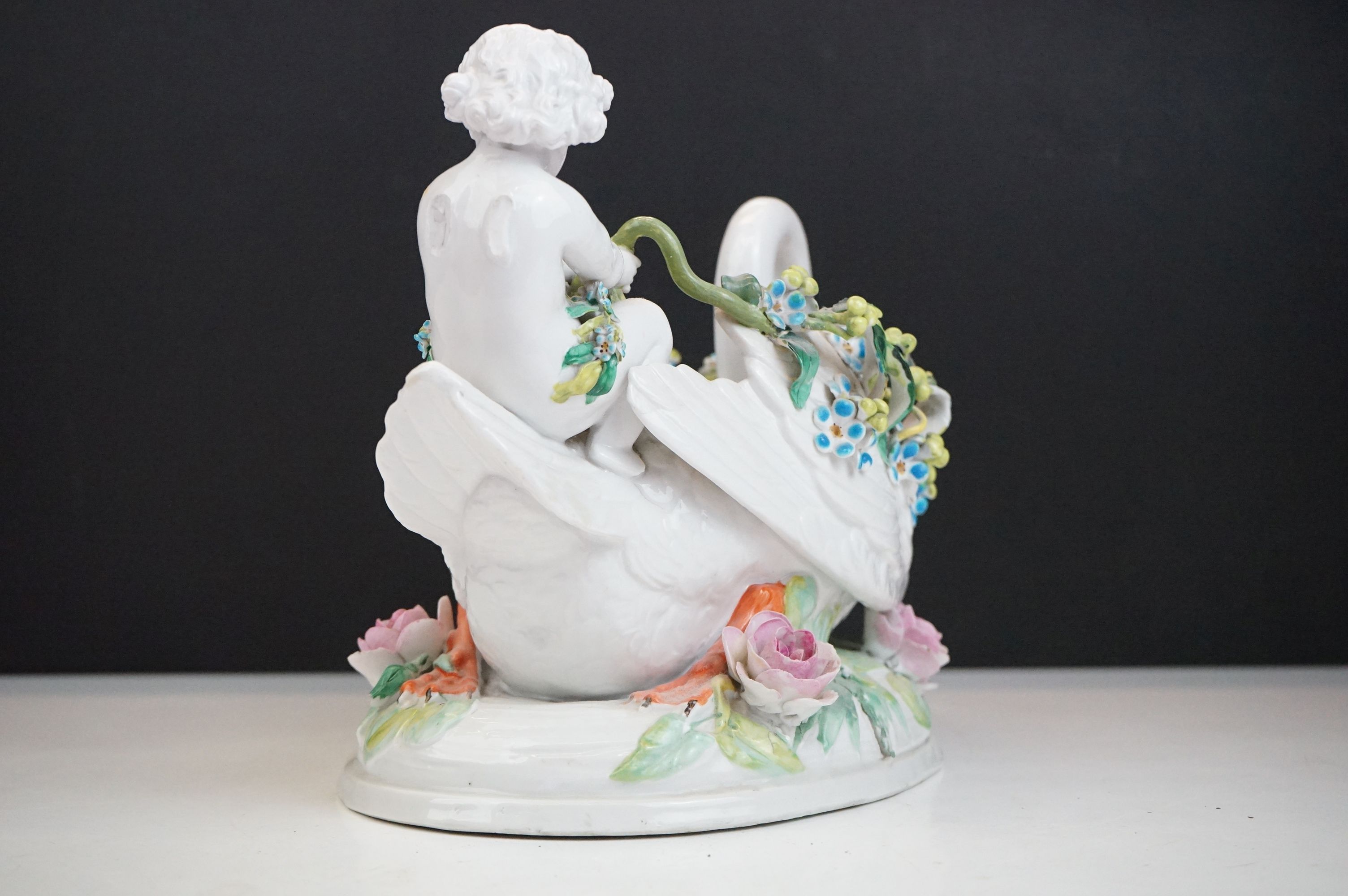 Group of three 19th Century porcelain pieces, comprising: a putti riding a flower encrusted swan, - Image 16 of 19
