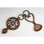 A hand carved Welsh double love spoon with ring link