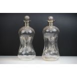 Pair of Edwardian 'glug glug' decanters with fully hallmarked silver collars and stoppers,