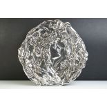 An Art Nouveau silvered ceramic wall plaque.