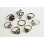 A collection of eight sterling silver ladies dress rings.